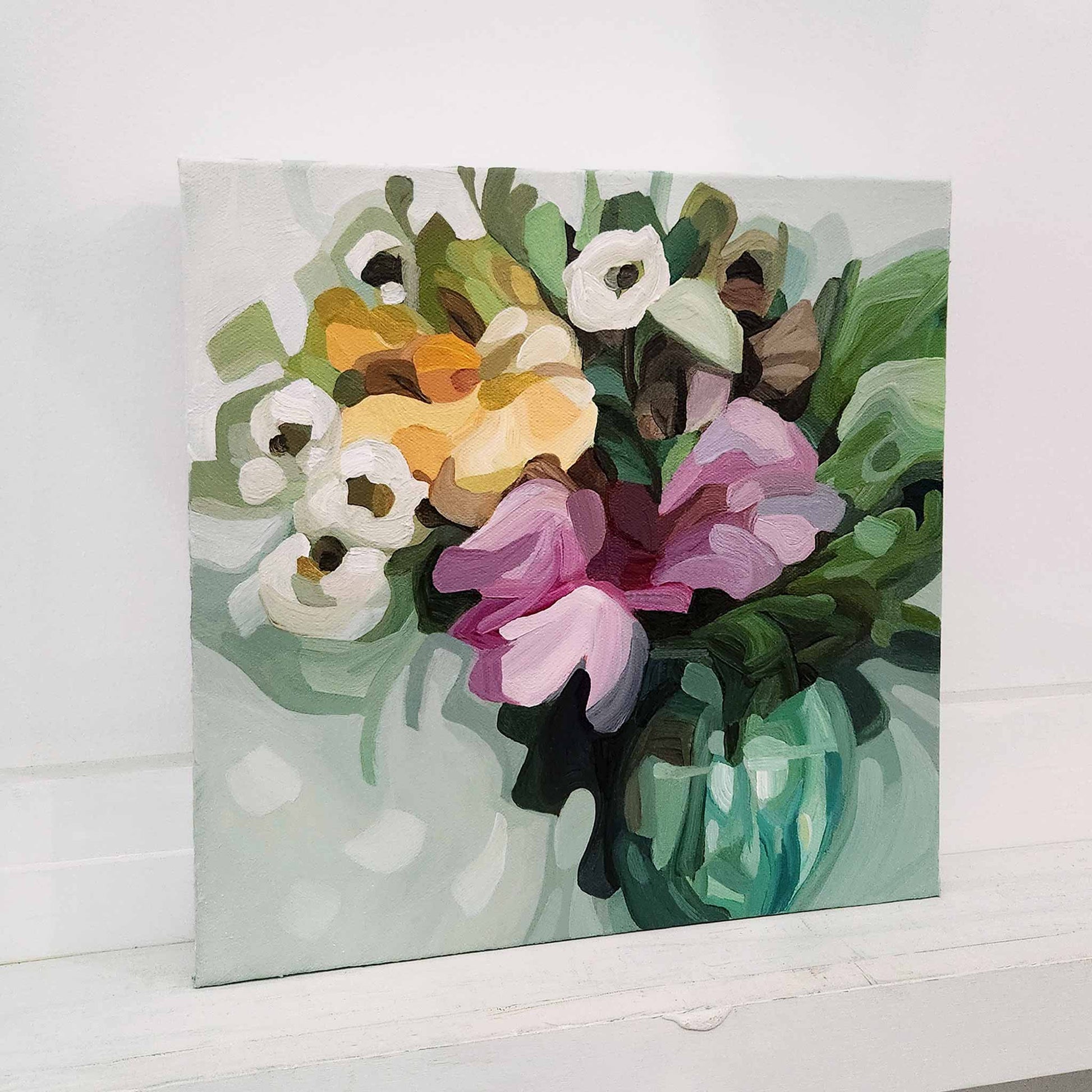 Contemporary floral artwork with mauve and pink blooms on green canvas