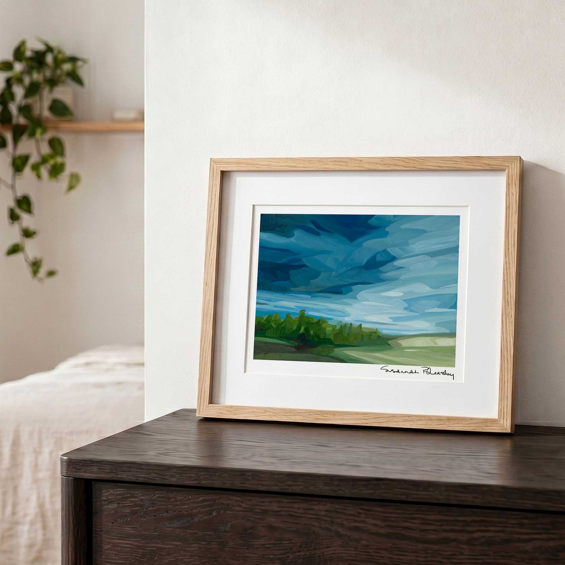 Contemporary landscape wall art featuring expressive storm clouds and rain moving across the open countryside