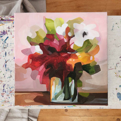 painting of red flowers in a vase