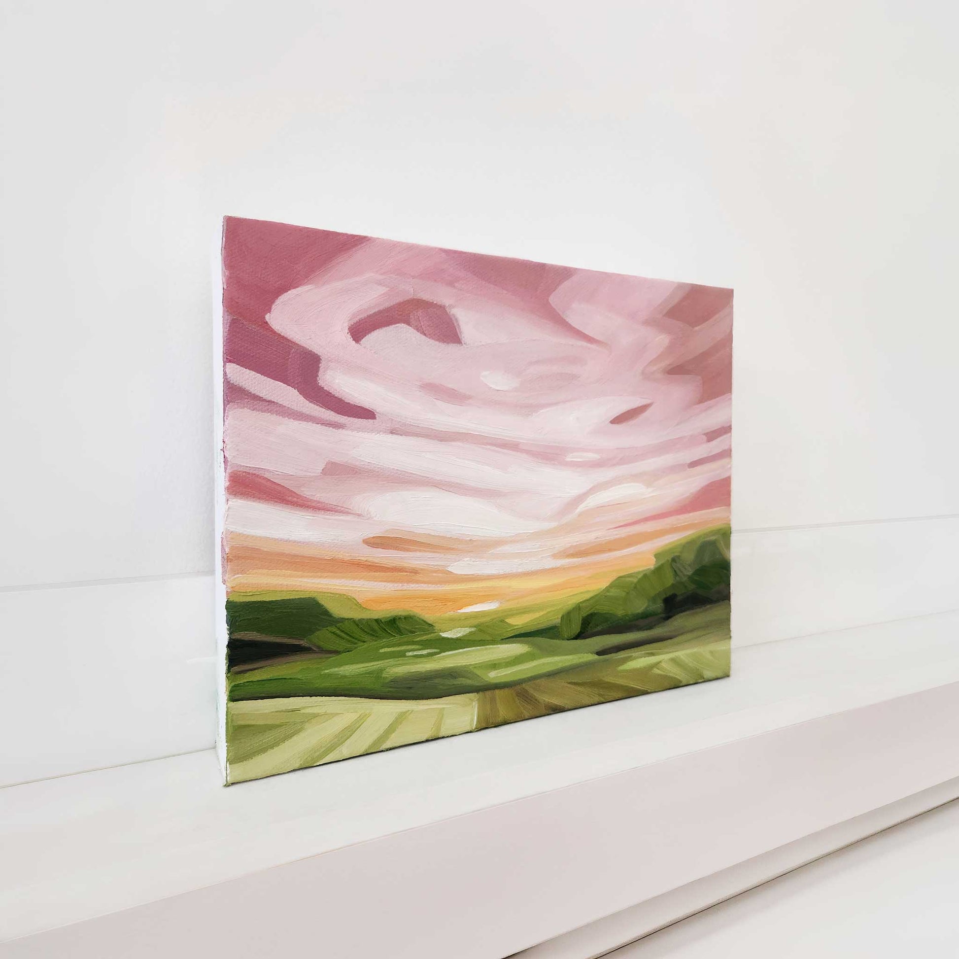 Contemporary abstract sky painting featuring soft pink tones and layered texture.