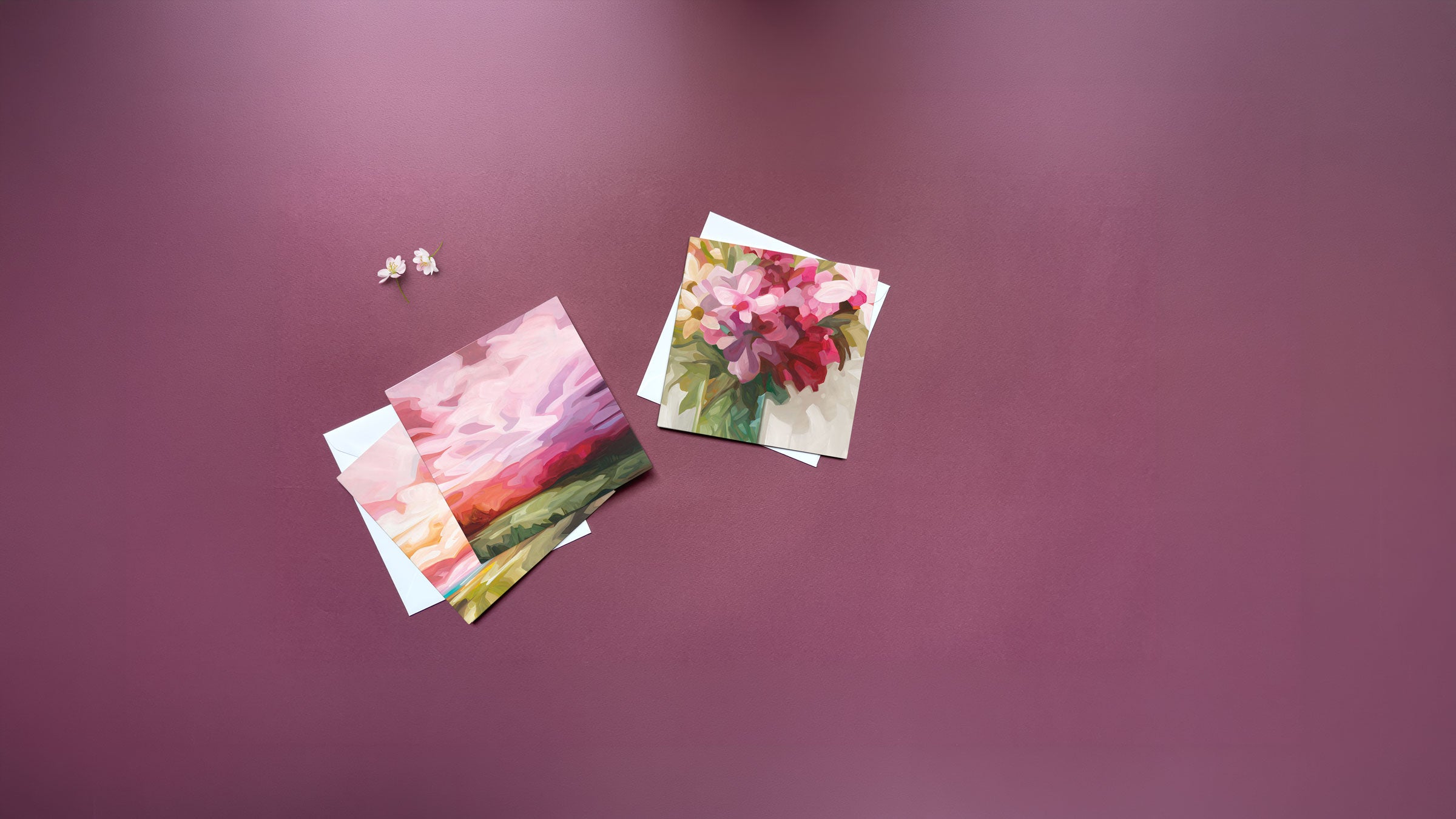 Pink art cards featuring floral paintings and abstract landscape artwork