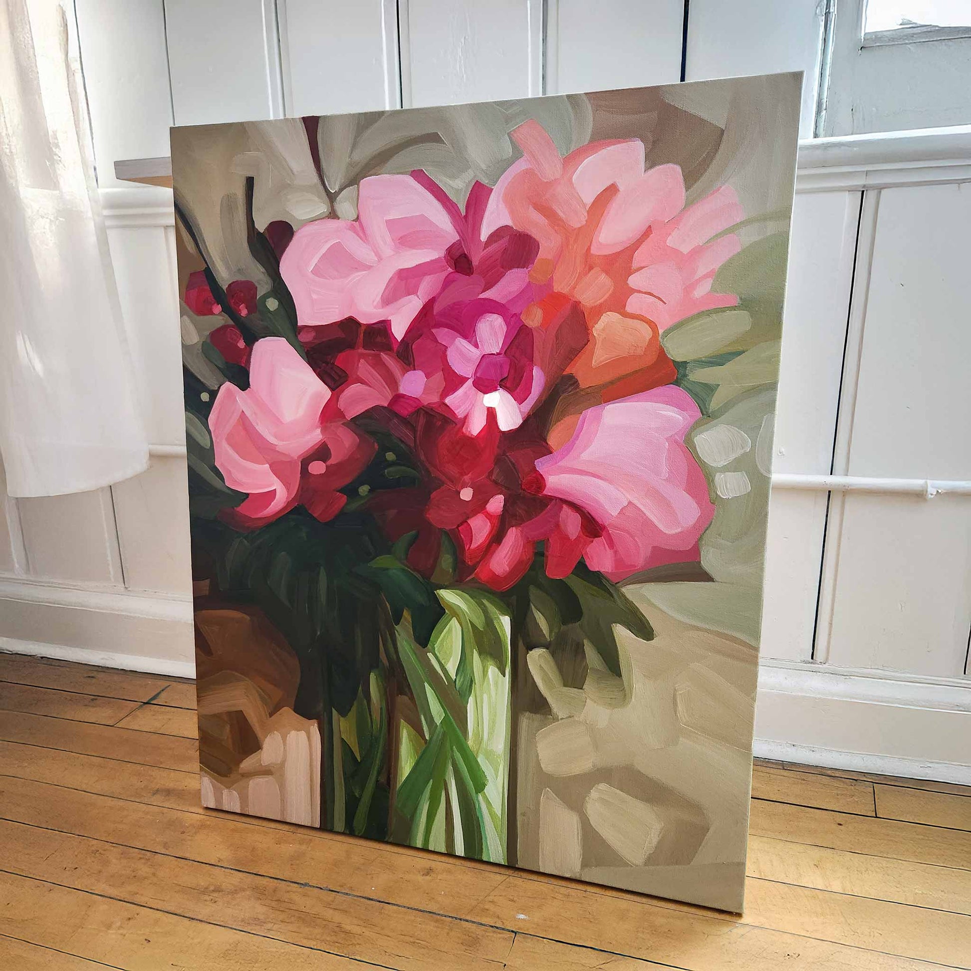 vertical abstract floral painting with pink blooms in studio