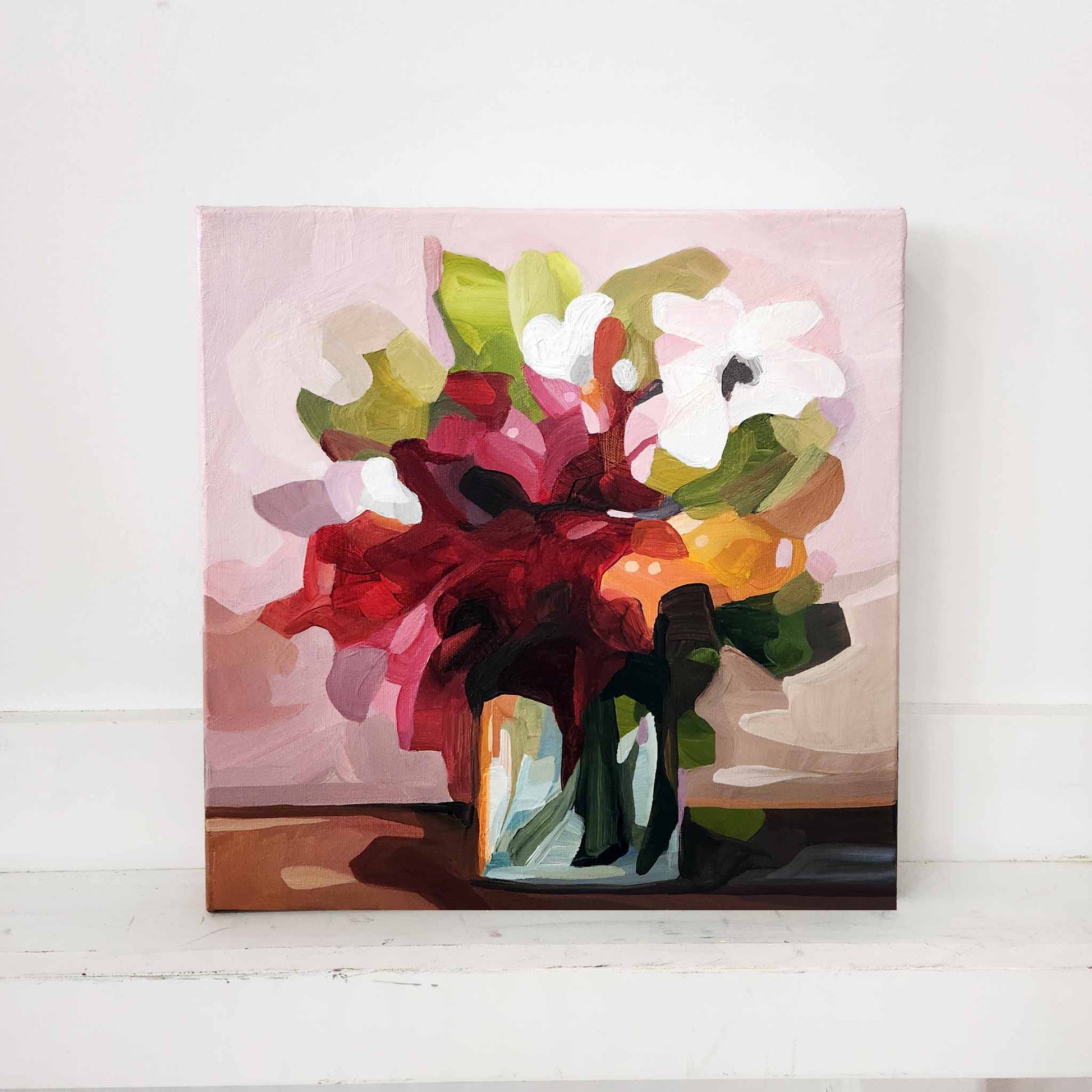 small abstract painting of red flowers in a vase