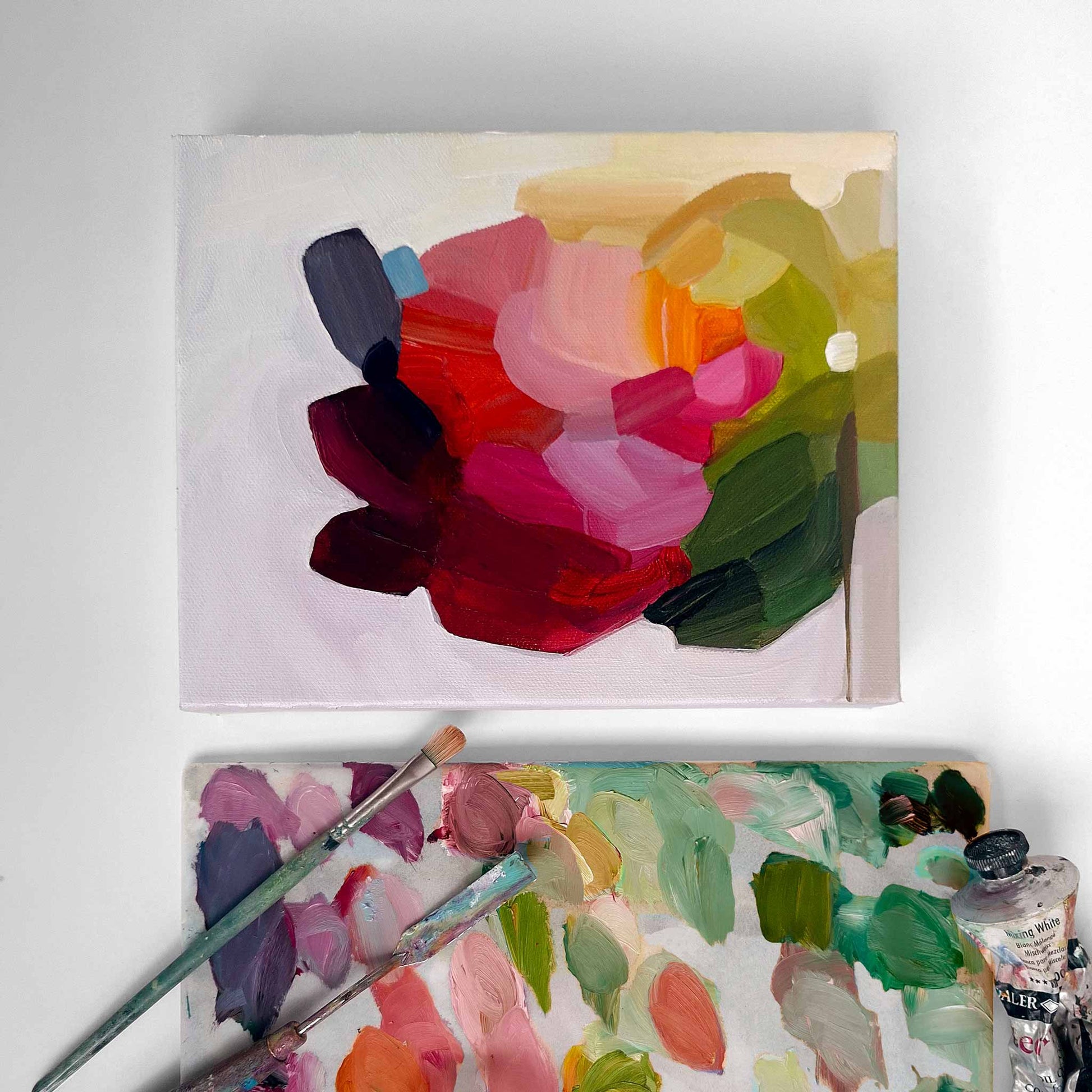 abstract floral painting on artist table