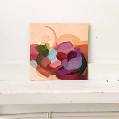 peach abstract painting with pale blue accent