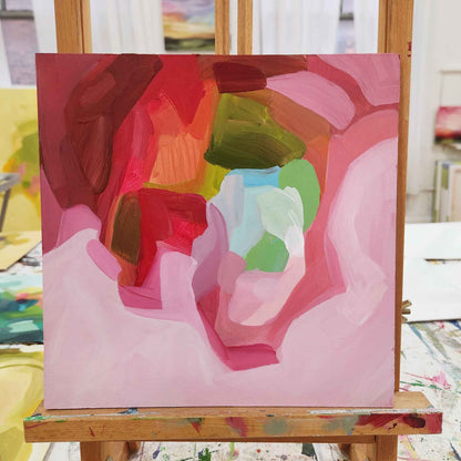 small pink abstract paintin on easel