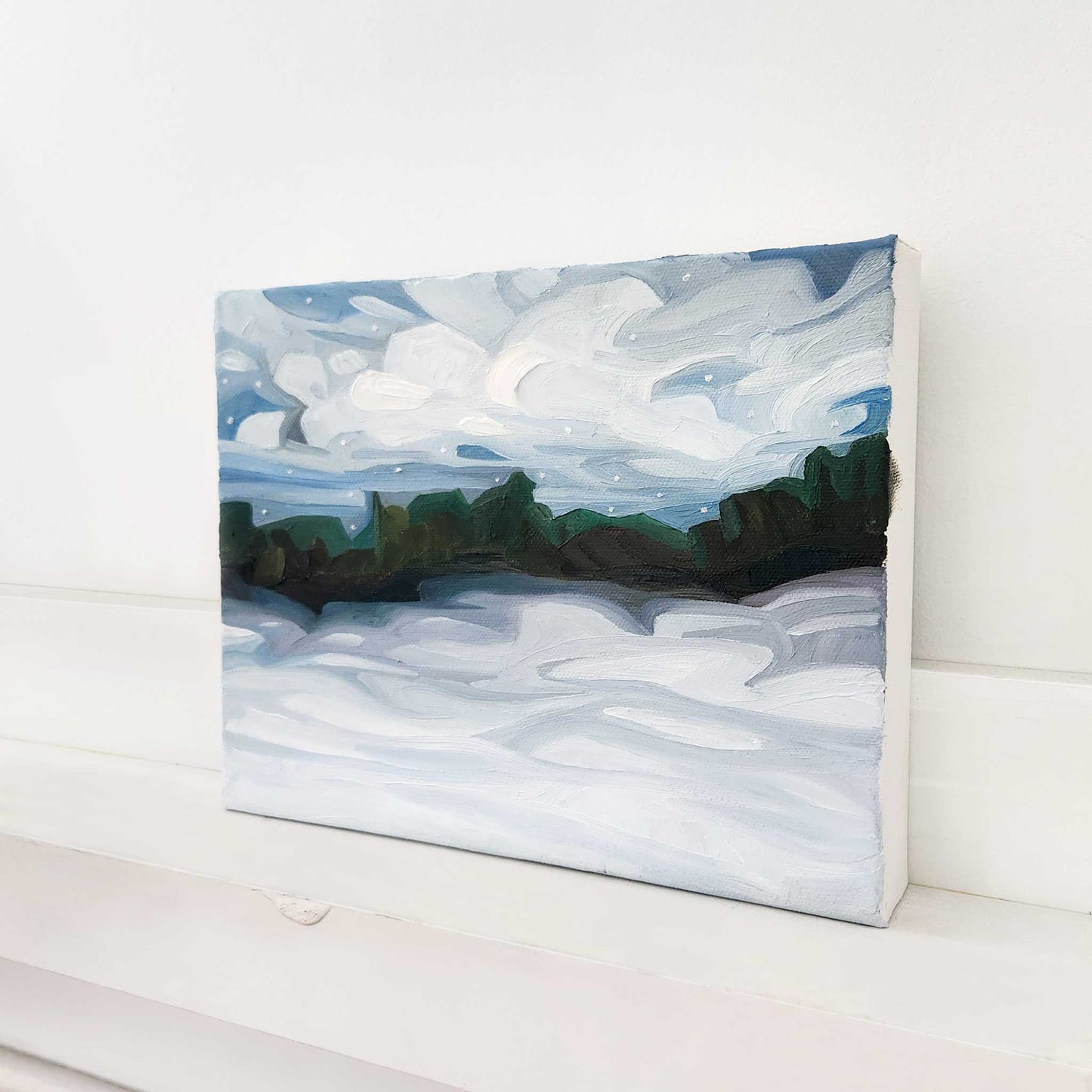 Original snowy countryside painting capturing the quiet beauty of winter.