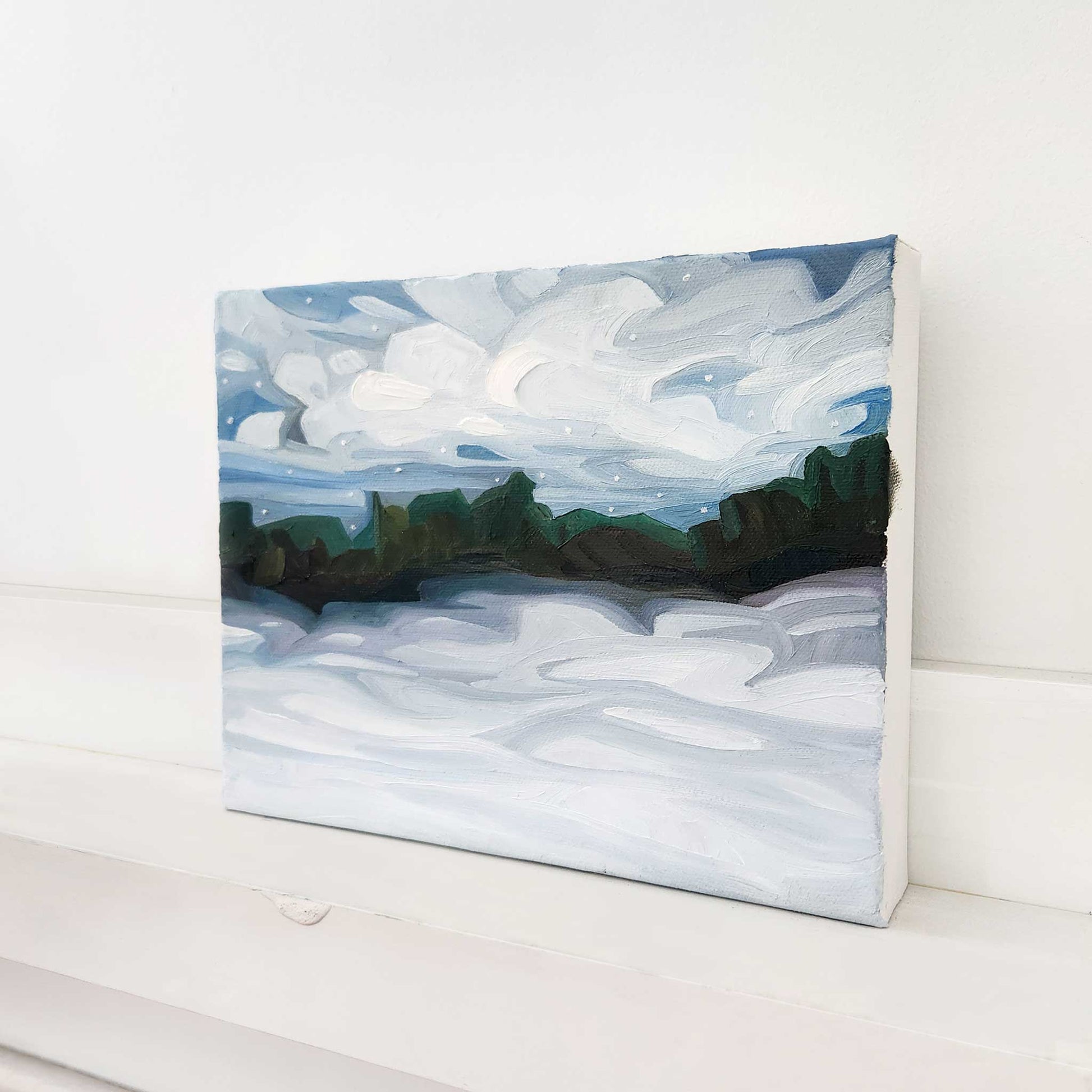 Original snowy countryside painting capturing the quiet beauty of winter.