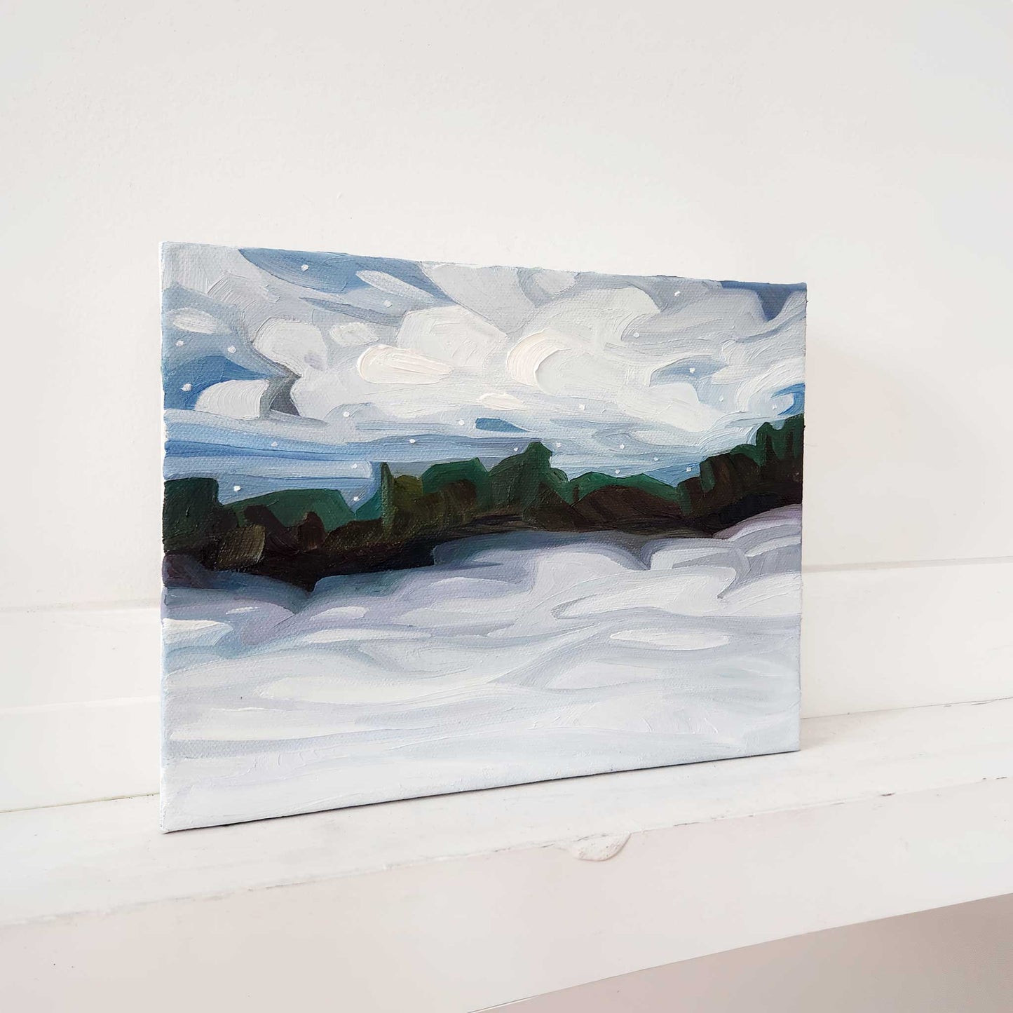 Winter landscape oil painting with snow-covered fields beneath a soft sky.
