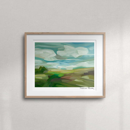Spring countryside landscape fine art print featuring green fields, a bright blue sky and thick puffy clouds