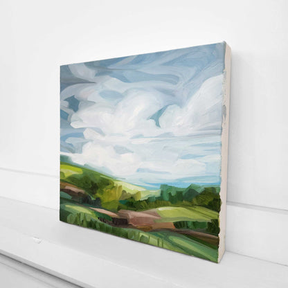 original countryside oil painting with lush green gras and blue skies inspired by a spring landscape