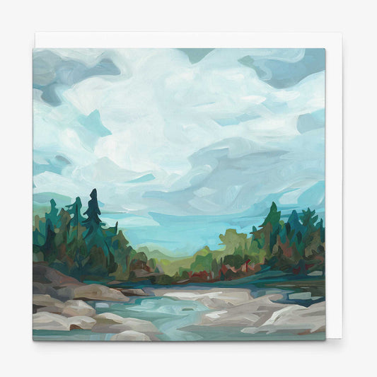Contemporary landscape greeting card with blue-grey skies, crystal clear water, and forested shoreline scenery