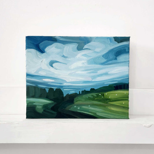 Original oil painting of a peaceful summer countryside filled with green fields and open skies.