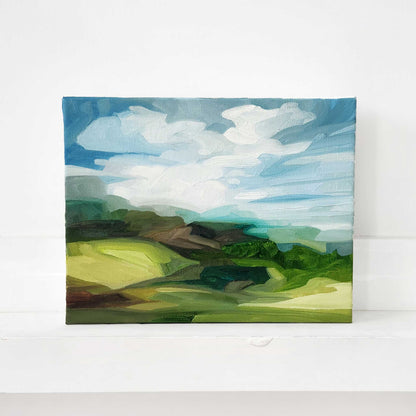 Contemporary oil painting of green hills in a vibrant summer landscape.