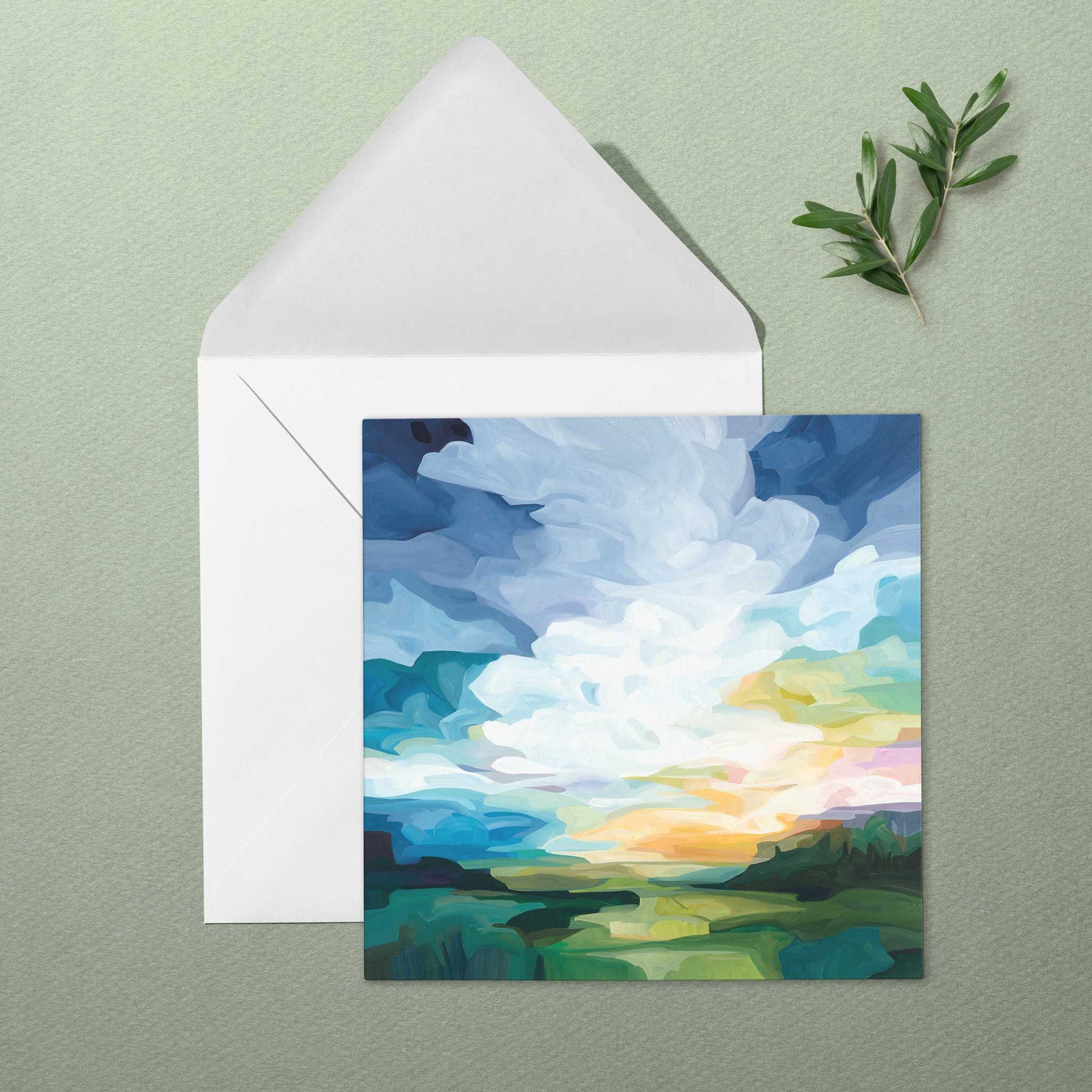 Colourful landscape art greeting card with green fields, glowing skies, and warm morning light