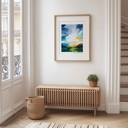 Sunrise landscape wall art displayed in a bright interior