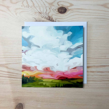 Abstract sky greeting card featuring colourful sunset clouds and glowing evening light over an expressive cloudscape