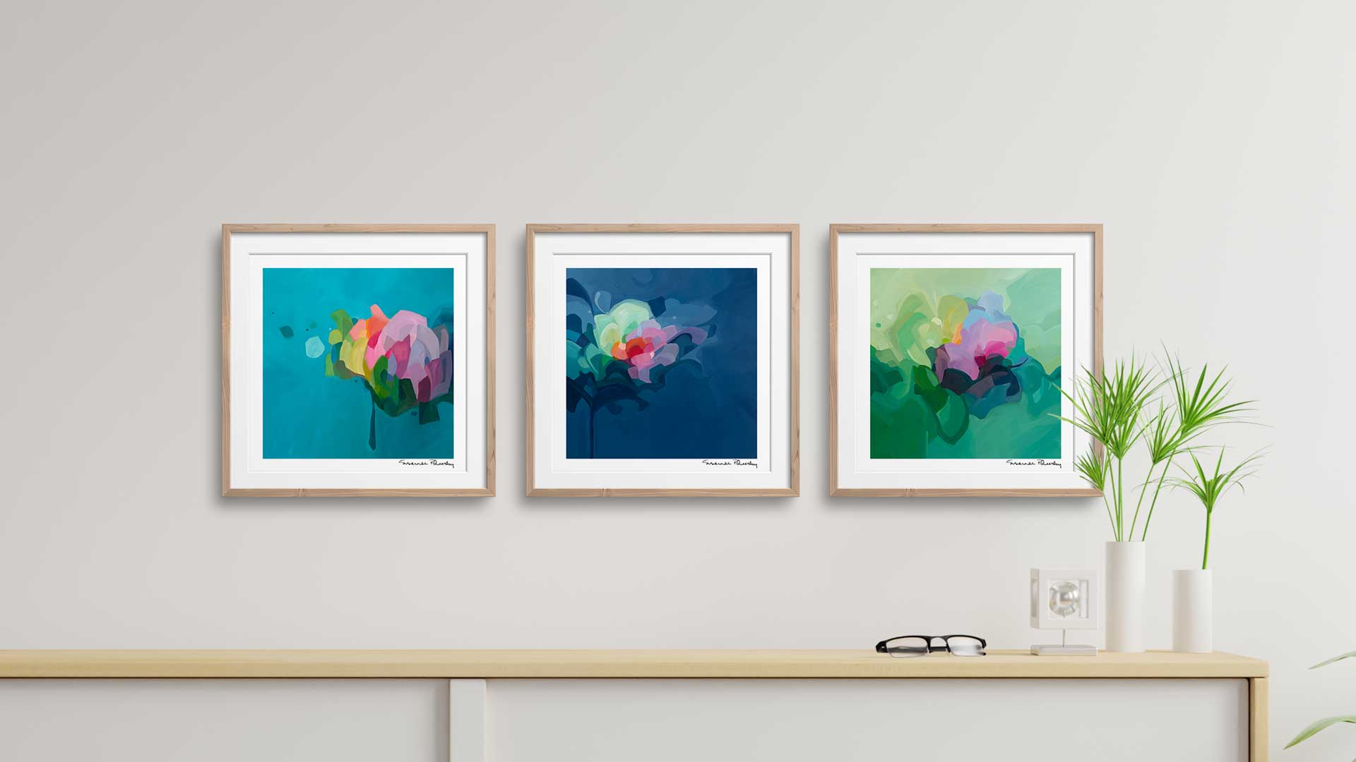 three abstract art prints in living room