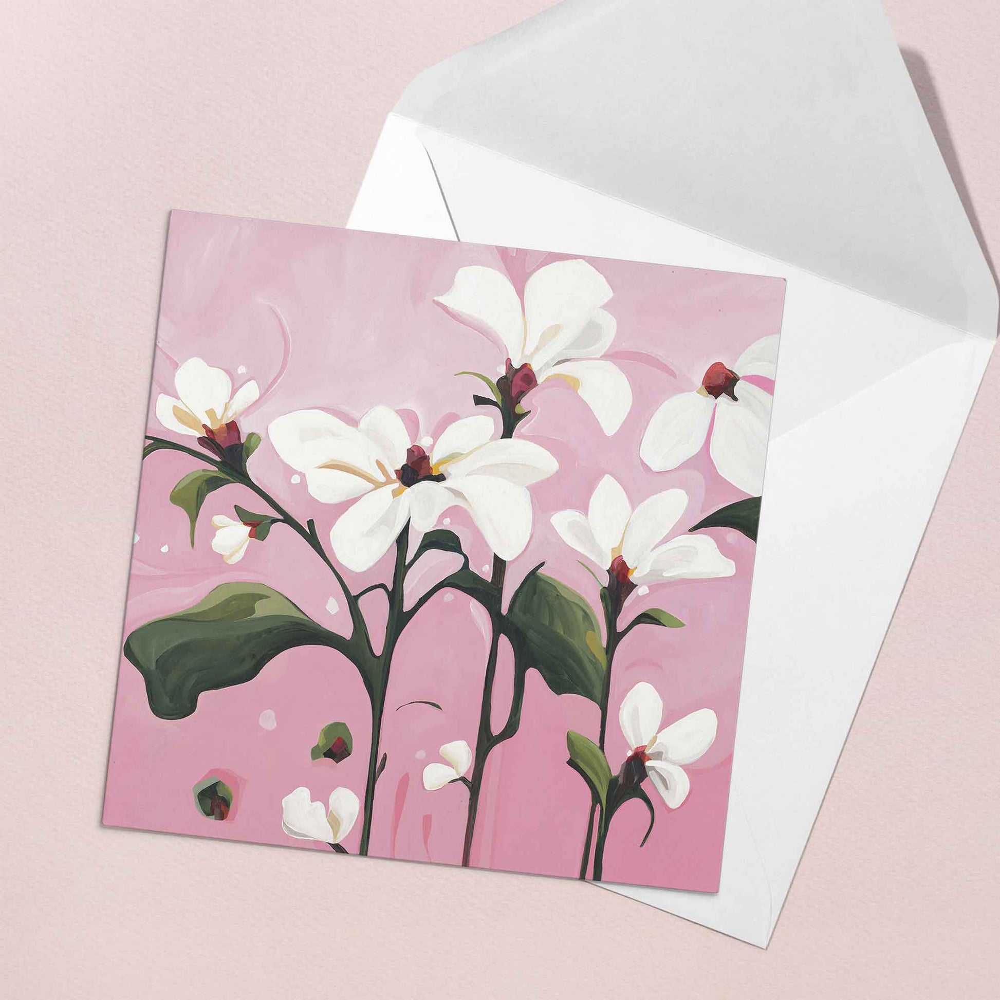 white floral greeting card pink background