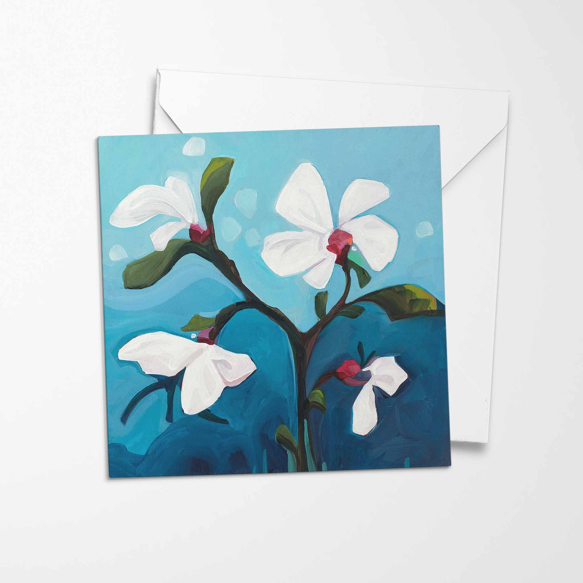 white flower greeting card bright blue background