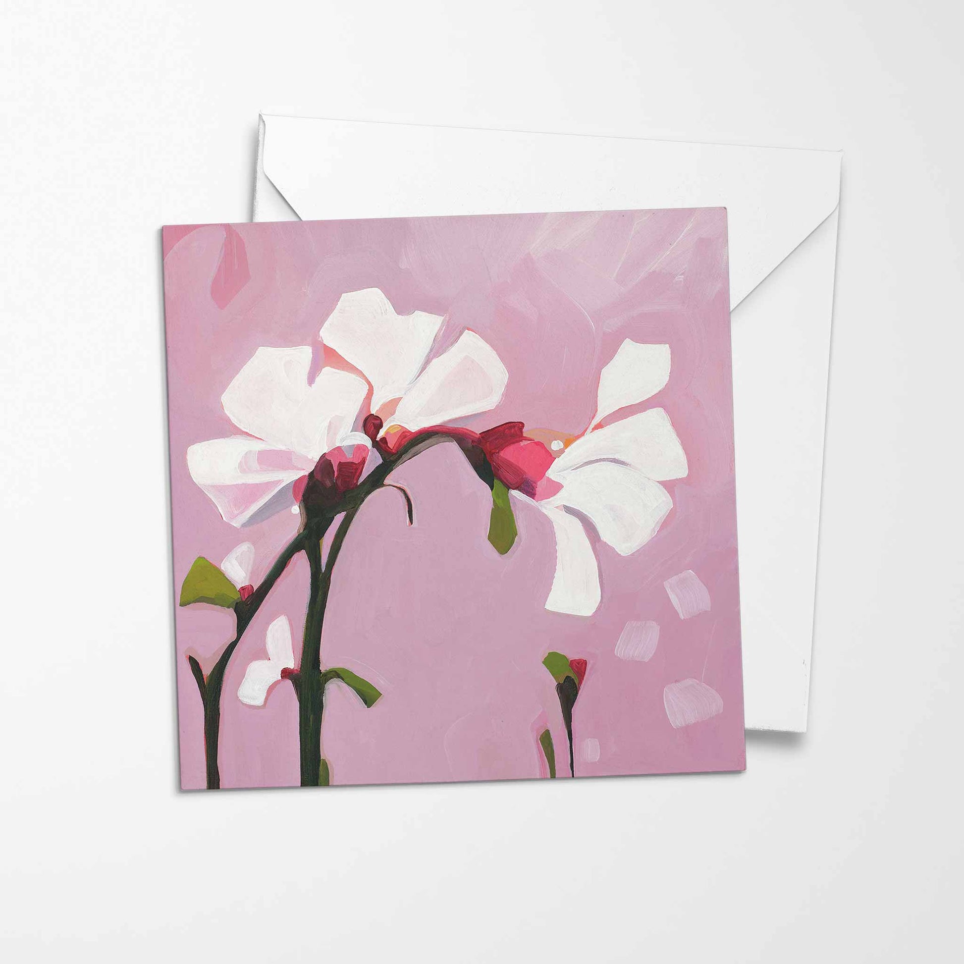 white flower greeting card with dusty pink background