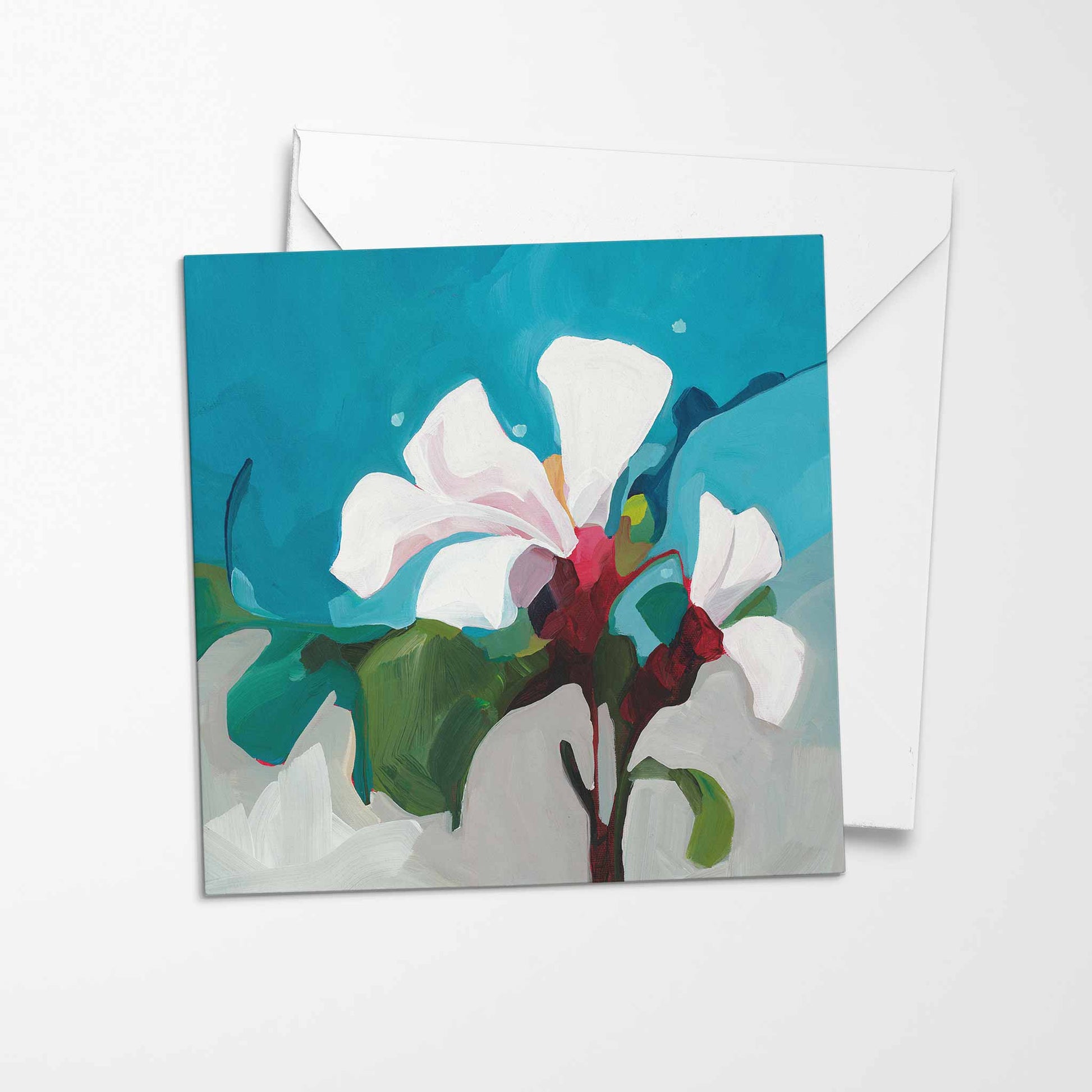 white flower greeting card teal background