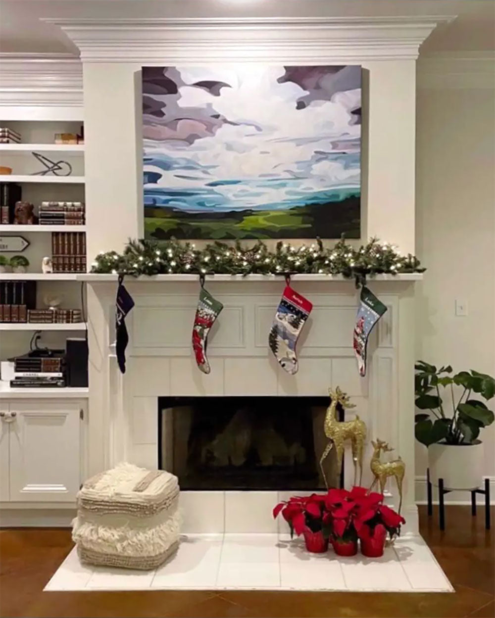 wide abstract landscape painting over fireplace