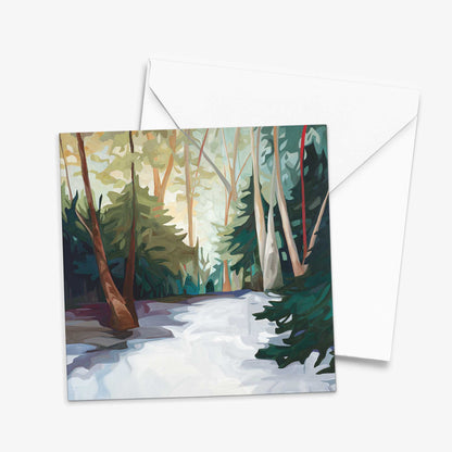 Winter art card featuring a snowy woodland landscape with sunlight through the trees