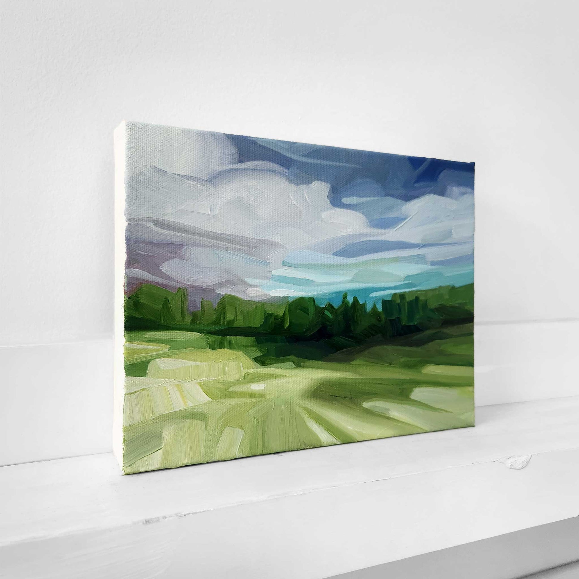 Original landscape painting featuring woodland and a peaceful horizon.
