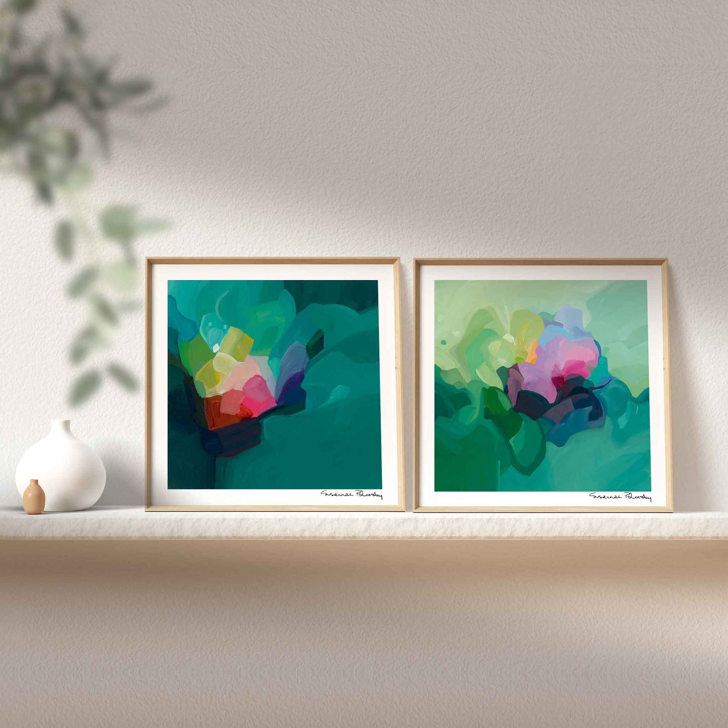 a colorful abstract art display with a pair of jade green and pine green framed abstract art prints