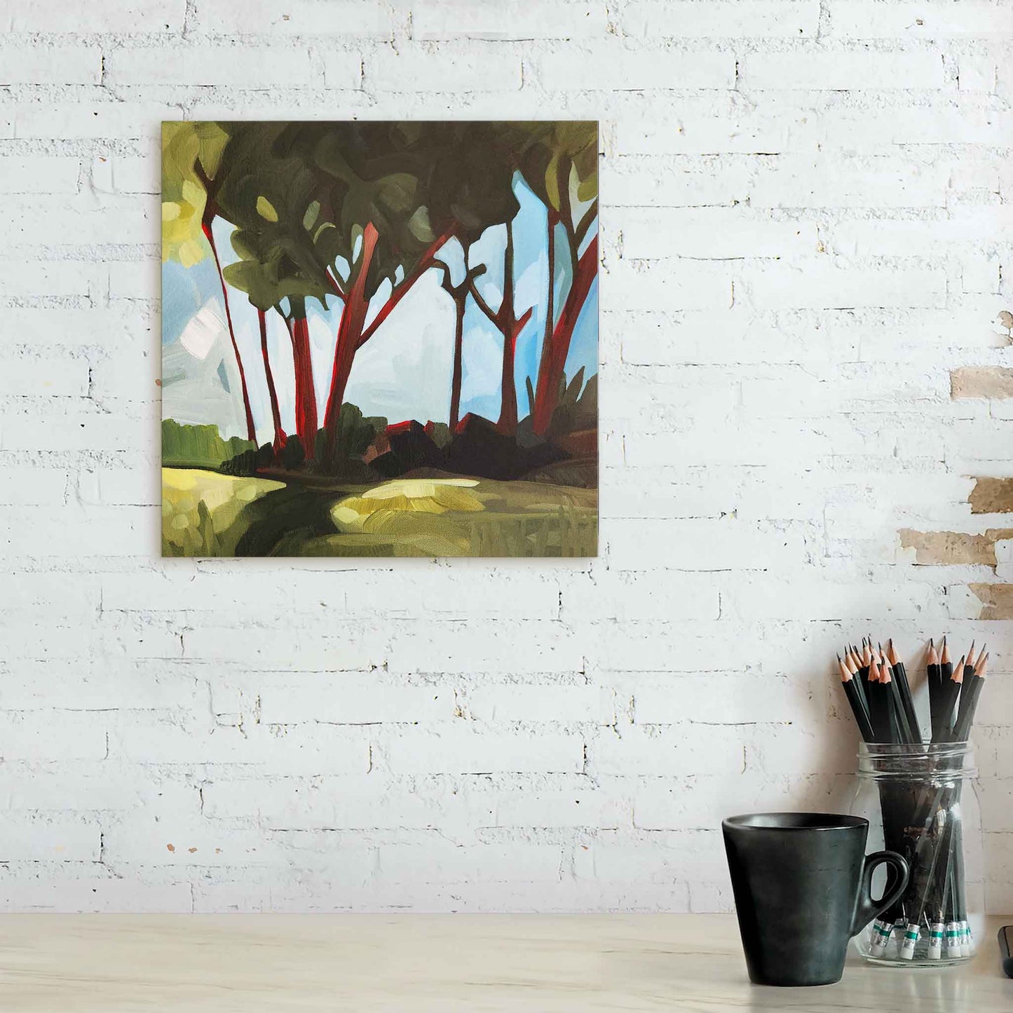 abstract forest painting from down to earth collection hanging on white brick wall