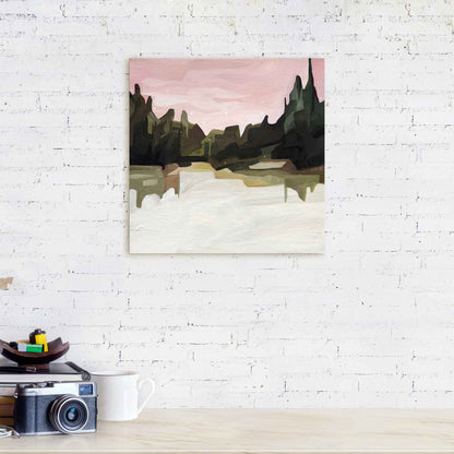 abstract forest painting of a winter forest under a pink sky hanging on a white brick wall
