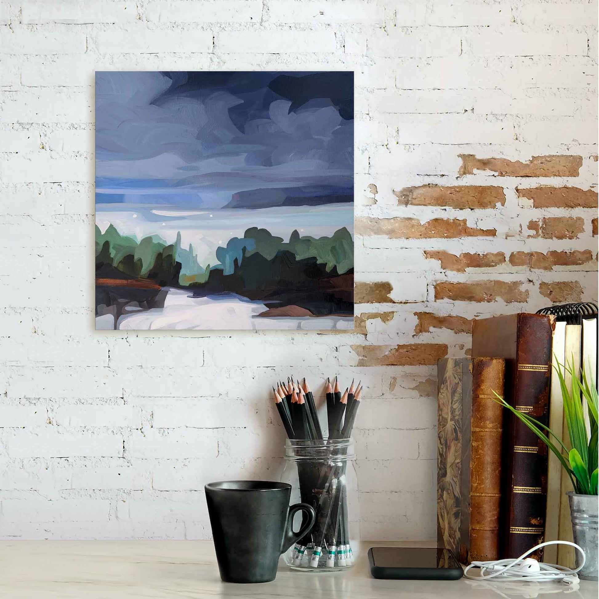 abstract forest painting of evening sky hanging over counter