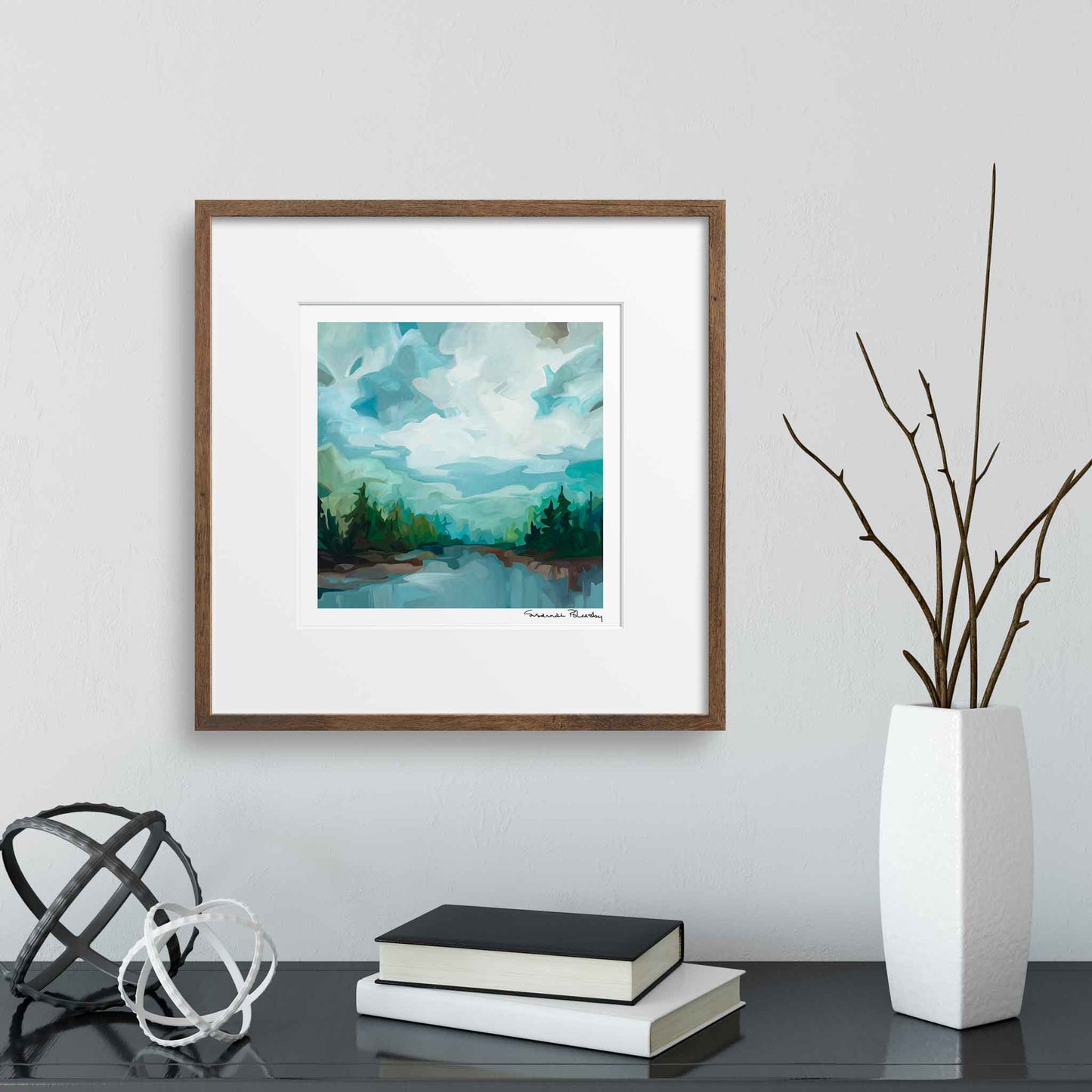 Fine art print of lake scene painting hanging over console table by Canadian abstract artist Susannah Bleasby