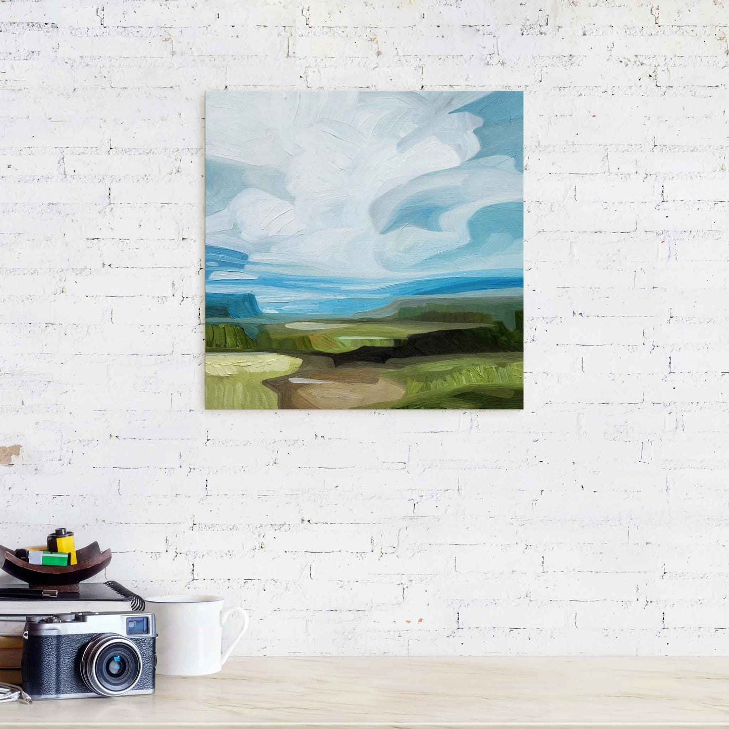 abstract landscape painting in oil paints hanging over counter